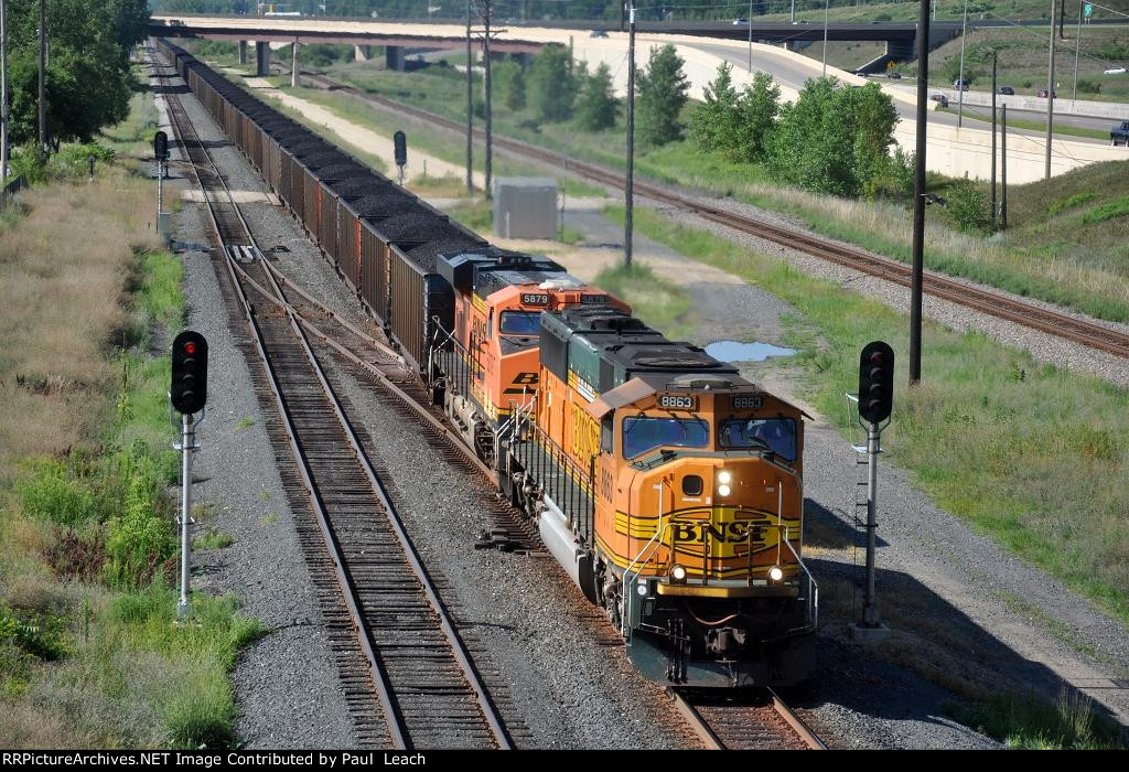 Loaded coal train rolls east